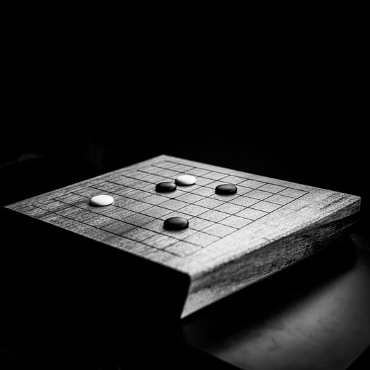 Go board on a walnut slab