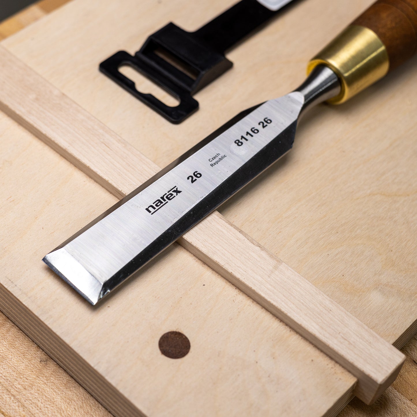 Sharpened and honed 26mm Narex bevel edge chisel with wooden handle.